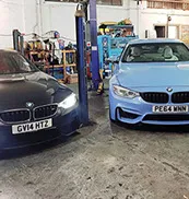 black and blue cars from an angle
