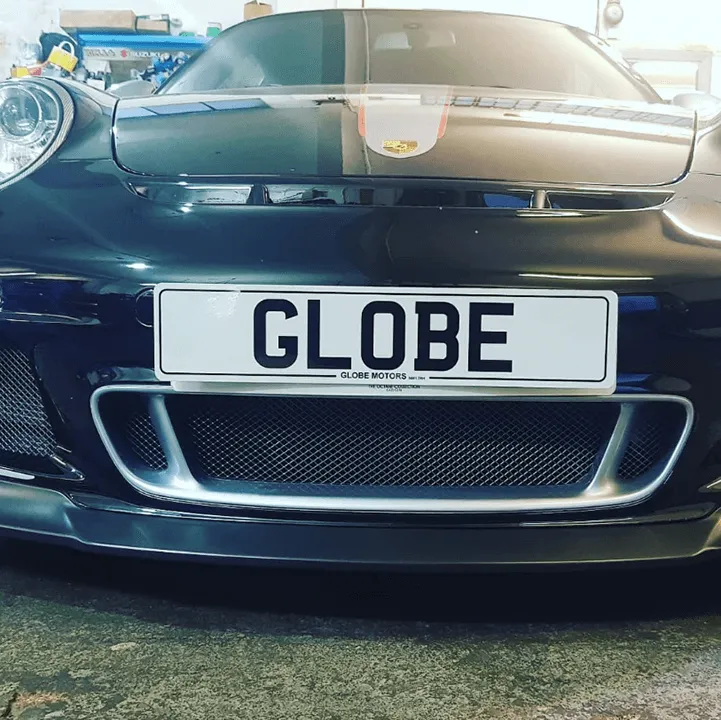 A close up of a car with a license plate.