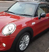 red and white car side on